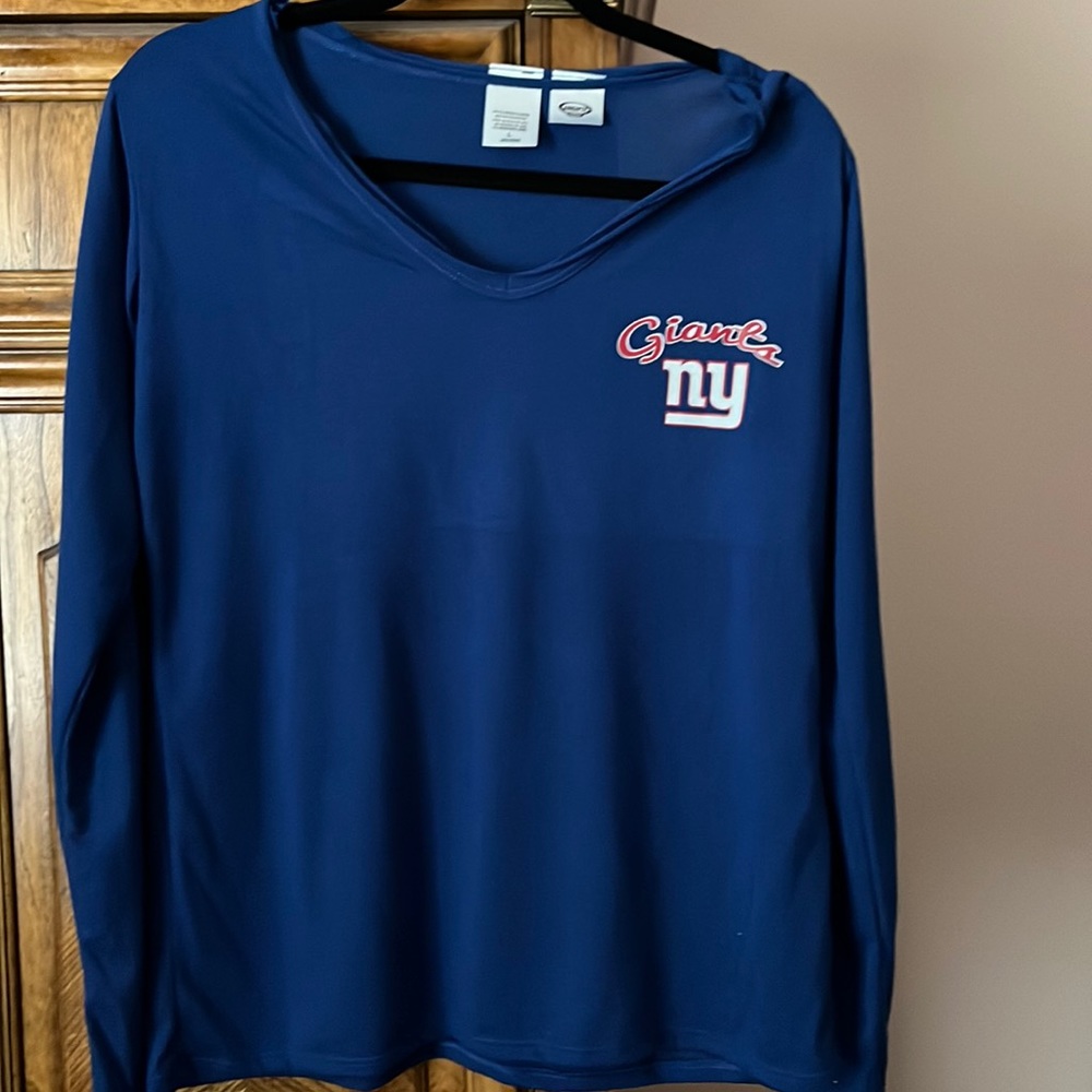 Giants long sleeve t-shirt never worn.  It’s polyester and rayon, size large.